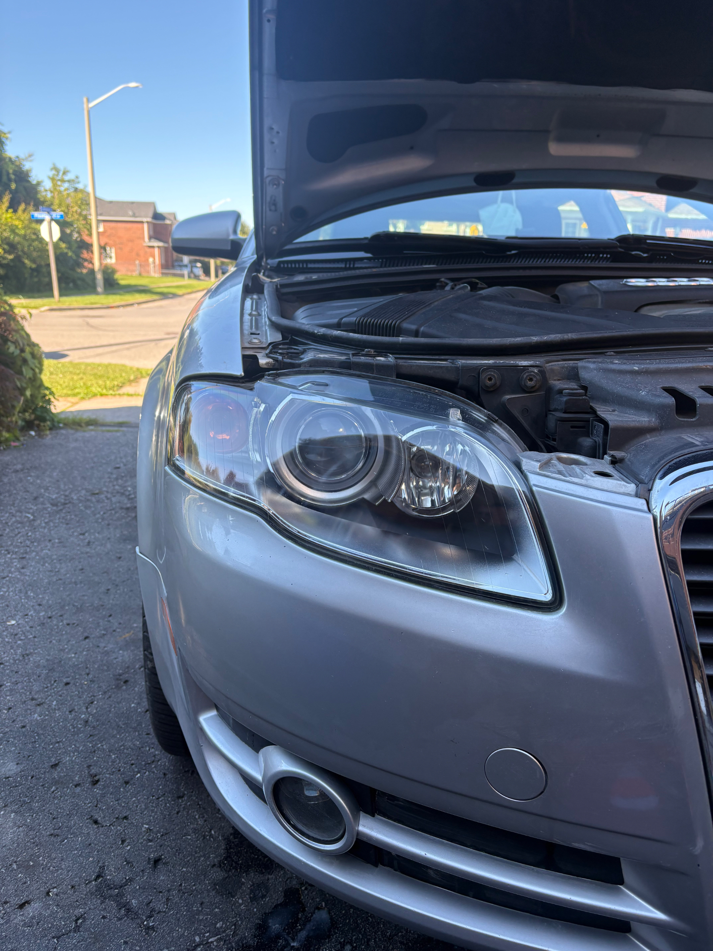 Crystal clear restored headlight on a silver Audi A4 after restoration